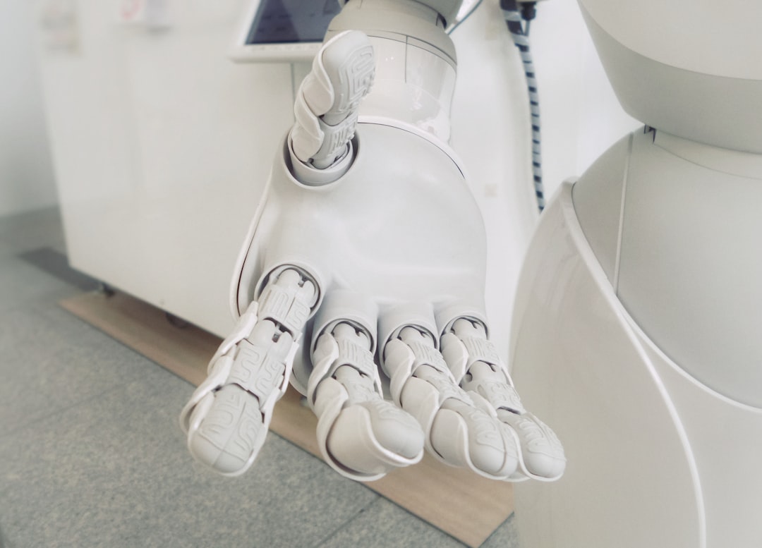 ロボットアームが物体を掴む様子、embodied AIとワールドモデルの物理世界学習のイメージ